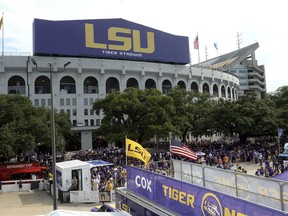 FILE - Preparations are made outside Tiger Stadium before an NCAA football game between LSU and Northwestern State in Baton Rouge, La, Sept. 14, 2019.