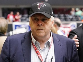 FILE - Frederick W. Smith, Chairman, President and CEO of FedEx Corporation is seen before the first half of an NFL football game between the Atlanta Falcons and the Philadelphia Eagles, Sunday, Sept. 12, 2021, in Atlanta.