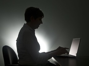 FILE - In this, Monday, Dec. 12, 2016, photo a woman types on her laptop, in Miami.