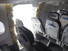 FILE - This image taken Jan. 7, 2024, and released by the National Transportation Safety Board, shows the section of a a Boeing 737 Max where a door plug fell while Alaska Airlines Flight 1282 was in flight. (NTSB via AP, File)