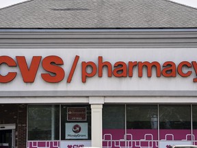 FILE - Signage hangs above a CVS pharmacy location in Philadelphia, June 6, 2025.
