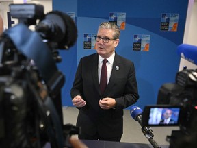 Britain's Prime Minister Keir Starmer speaks to the media as he arrives for the NATO summit of heads of state and government in The Hague Wednesday, June 25, 2025.