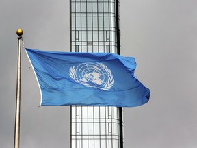 FILE - The United Nations flag flies on a stormy day at the U.N. during the United Nations General Assembly, Sept. 22, 2022.