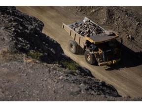 A dump truck moves raw ore inside a mine used by a rare earths producer.