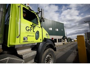 A GFL Environmental Inc. garbage truck arrives at a transfer station in Toronto, Ontario, Canada, on Thursday, Oct. 24, 2019. GFL, North America's fourth-largest waste hauler by revenue, seeks to raise as much as $2.1 billion in what would be the largest initial public offering in Canada since 2004.