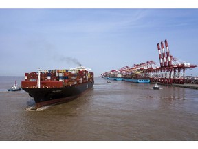 A container ship sails out of the Yangshan Deepwater Port in Shanghai.