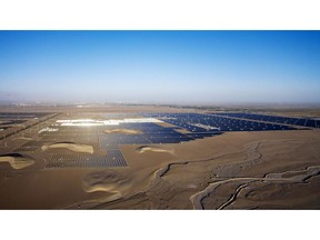 Photovoltaic modules at a solar power plant near Golmud, Qinghai province, China, on Saturday, Sept. 11, 2021. China is opening up its market for trading green energy, making it easier for multinationals from BMW AG to Airbus SE to buy wind and solar power and reach aggressive emissions goals.