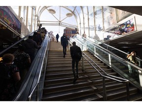 Commuters climb the stairs to exit Liverpool Street railway station in London, UK.