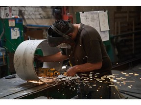 A worker grinds a stainless steel tube at a steel manufacturing facility in Mexico City, Mexico, on Thursday, Feb. 6, 2025.