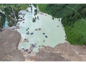 Rubble and ice fill in part of the Loetschental valley following a landslide at Blatten, Switzerland.