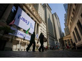 JBS NV signage at the New York Stock Exchange (NYSE) in New York, US, on Wednesday, June 25, 2025. JBS NV shares started trading in New York on June 13, giving the world's largest meat producer a market value of about $15 billion as it culminated a years-long effort to reach a broader pool of investors.