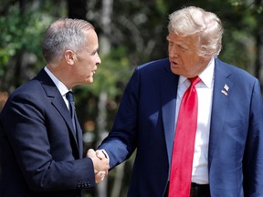 Canadian Prime Minister Mark Carney, left, shakes hands with U.S. President Donald Trump at the G7 summit in Alberta this week.