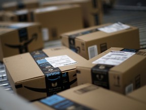 Boxes move along a conveyor belt at an Amazon.com Inc. fulfillment centre.