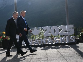 Prime Minister Mark Carney, left, and U.S. President Donald Trump during the Group of Seven Summit at the Kananaskis Country Golf Course in Kananaskis, Alta.