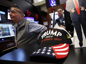 Traders work on the floor of the New York Stock Exchange in New York City.