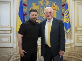 Ukrainian President Volodymyr Zelenskyy, left, and United States Special Envoy for Ukraine and Russia, Joseph Keith Kellogg pose for a photo in Kyiv, Ukraine, Monday, July 14, 2025. (Ukrainian Presidential Press Office via AP)
