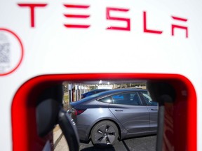 FILE - A Tesla level three Electric vehicle charger is visible, Feb. 2, 2024, in Kennesaw, Ga., near Atlanta.