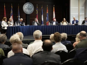 FILE - Members of the Tennessee Valley Authority Board of Directors listen to members of the public during a meeting May 8, 2024, in Nashville, Tenn.
