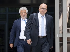 Former Meta board member and former White House Chief of Staff Jeffrey Zients, left, exits the Leonard L. Williams Justice Center after testifying in a shareholders' lawsuit against current and former Meta leaders on Wednesday, July 16, 2025, in Wilmington, Del.