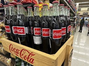 Bottles of Mexican Coca-Cola are displayed at a grocery store in Mount Prospect, Ill., Thursday, July 17, 2025.