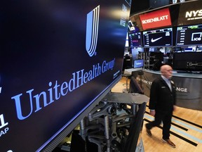FILE - The logo for UnitedHealth Group appears above a trading post on the floor of the New York Stock Exchange, April 17, 2025.
