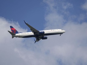 FILE - A Delta Airlines plane lands at Sarasota-Bradenton International Airport Friday, March 28, 2025.