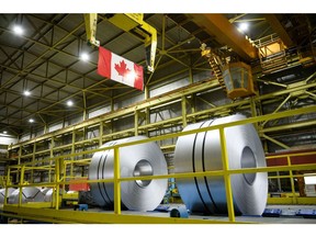 Spools of steel at an ArcelorMittal Dofasco facility in Hamilton, Ontario, Canada, on Wednesday, March 12, 2025. Canada will keep its trade retaliation in place until the US lifts its own tariffs and commits to free trade, said Mark Carney, who will succeed Justin Trudeau as Canada's prime minister within days.
