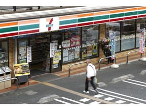 A shopper enters a 7-Eleven convenience store, operated by Seven & i Holdings Co., in Tokyo, Japan, on Tuesday, April 8, 2025. Seven & i Holdings will release it's earnings figures on April 9.