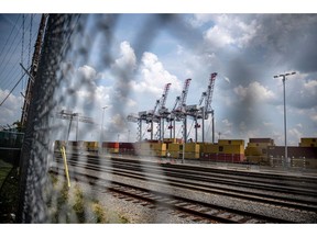 Gantry cranes and shipping containers at the Port of Montreal in Montreal, Quebec, Canada, on Saturday, July 12, 2025. US President Donald Trump threatened a 35% tariff on some Canadian goods and raised the prospect of increasing levies on most other countries, ramping up his trade rhetoric in comments that weighed on stocks and boosted the US dollar.