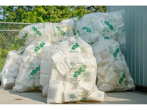 Triple-rinsed and bagged pesticide and fertilizer containers 23L and under, ready to be picked up for recycling.