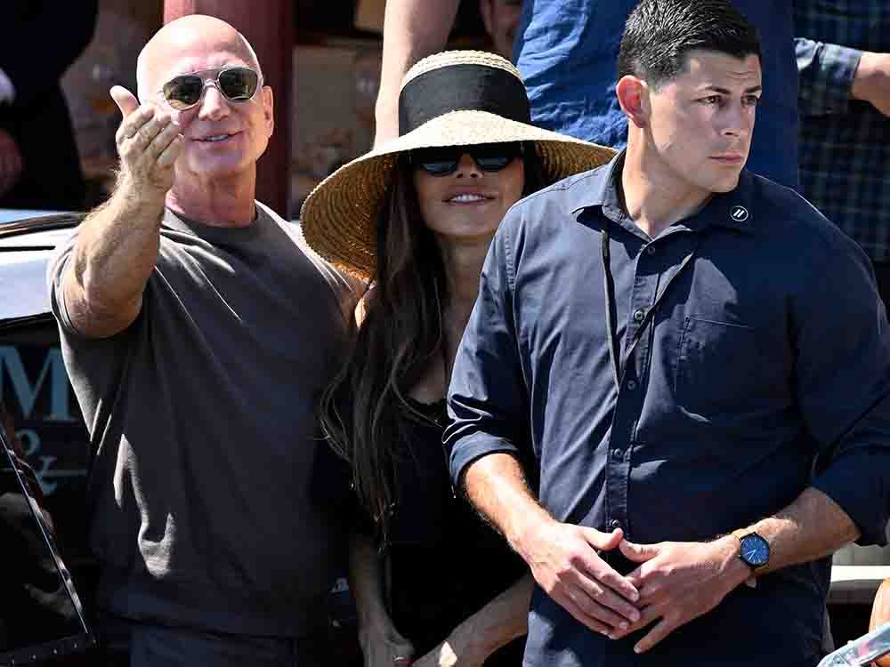 Amazon founder Jeff Bezos and his wife Lauren Sanchez Bezos leave the Harry's Bar restaurant a day after their wedding in Venice on June 28, 2025. A recent sale of Amazon shares by Bezos coincided with his star-studded wedding.