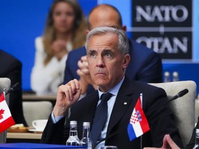 Prime Minister Mark Carney takes part in a meeting of the North Atlantic Council during the NATO Summit in The Hague, Netherlands on June 25.