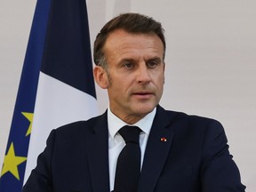 French President Emmanuel Macron speaks to the army leaders at the Hotel le Brienne, Sunday, July 13, 2025, ahead of the Bastille Day parade in Paris.