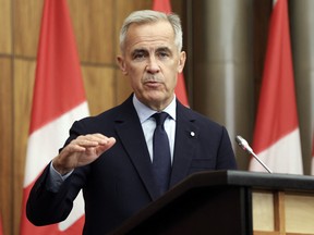 Prime Minister Mark Carney speaks during a press conference at the National News Theater on Parliament Hill in Ottawa.