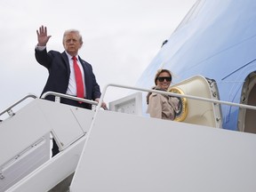 U.S. President Donald Trump and first lady Melania Trump board Air Force One, Tuesday, Sept. 16, 2025, in Joint Base Andrews, Md.