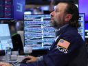 Traders work on the floor of the New York Stock Exchange during morning trading on Sept. 17, 2025 in New York City.