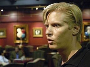 FILE - Eric Langan, president and CEO of Rick's Cabaret International Inc., speaks during the company's annual stockholders meeting, Aug. 27, 2004, in Houston.