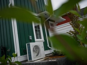 A heat pump unit is seen outside a new single family house billed as an estate cottage, in Delta, B.C., on Monday, Aug. 12, 2024.