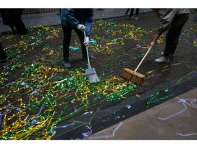 Workers clean up confetti during the Hinge Health initial public offering (IPO) outside the New York Stock Exchange (NYSE) in New York, US, on Thursday, May 22, 2025. Hinge Health Inc. and a group of investors raised $437 million in the digital physical therapy provider's US initial public offering, pricing shares at the top of a marketed range.