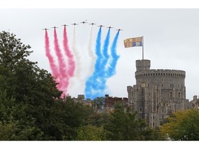 The RAF Red Arrows perform a flyover at Windsor Castle on Sept. 17.