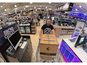 A man excitedly buying the Flashforge AD5X Multi-Color FDM 3D Printer at Micro Center.