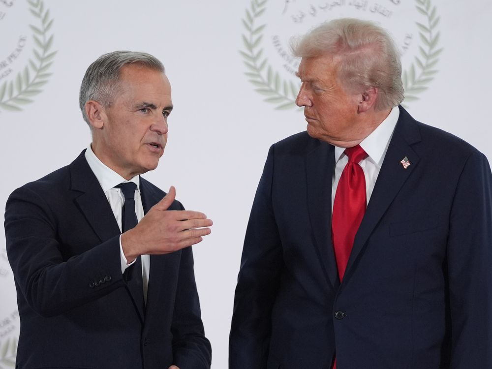 President Donald Trump greets Canada's Prime Minister Mark Carney during a summit in Sharm El Sheikh, Egypt.