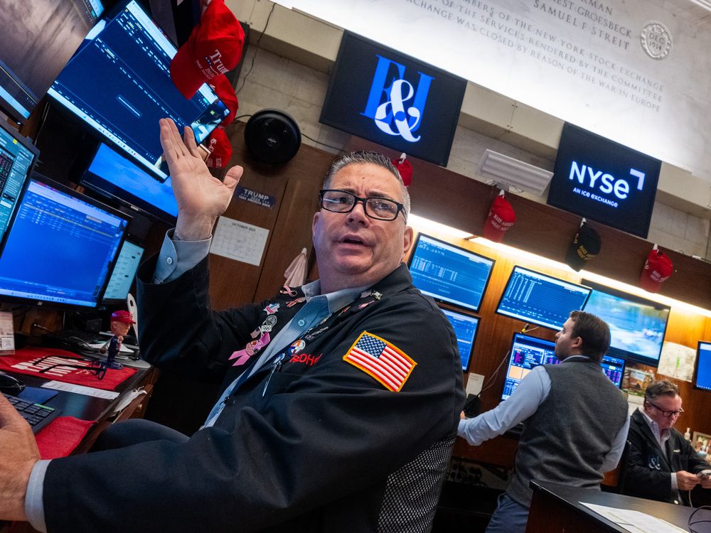Traders work on the floor of the New York Stock Exchange (NYSE) on October 17, 2025 in New York City.