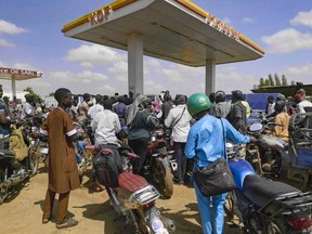 People queue with their motorcycles at a gas station amid a fuel shortage in Bamako Mali, Tuesday, Oct 7, 2025 (AP Photo)
