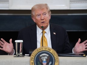 President Donald Trump answers questions from reporters during a roundtable on criminal cartels in the State Dining Room of the White House, Thursday, Oct. 23, 2025, in Washington.