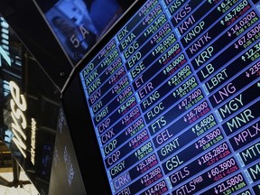A board above the trading floor of the New York Stock Exchange with stock symbols is shown in this image, Tuesday, July 1, 2025.