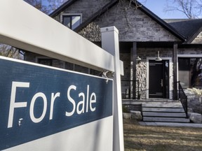 A “For Sale” real estate sign in Mississauga.