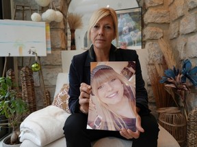 FILE - Stephanie Mistre holds a picture of her daughter, Marie Le Tiec, a teenager who died by suicide in 2021, on Dec. 10, 2024, in Cassis, France.