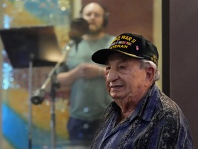 Irving Locker, a 101-year-old veteran of World War II, D-Day and the Battle of the Bulge, listens as Jesse Wayne Taylor, left, records a song based on Locker's military experience on Wednesday, Sept. 9, 2025, in Nashville, Tenn.
