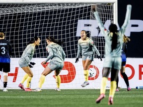 Vancouver Rise's Samantha Chang (8), centre right, jumps in celebration of her teammate Holly Ward's goal against the Ottawa Rapid during second half Northern Super League semifinal soccer action in Ottawa, on Saturday, Nov. 8, 2025.
